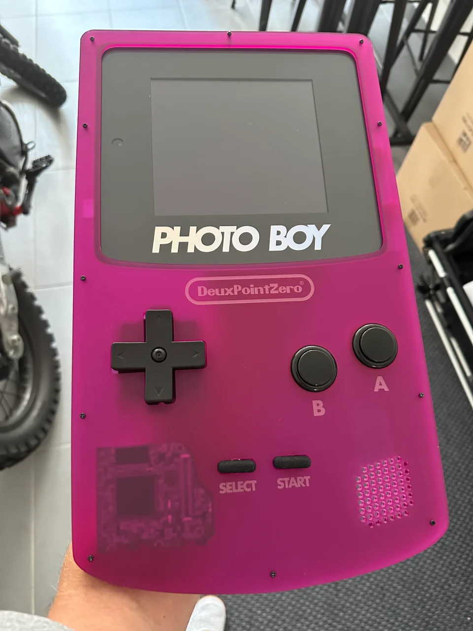Photoboy, a pink Game Boy-shaped photo booth with an iPad mini and arcade controls.